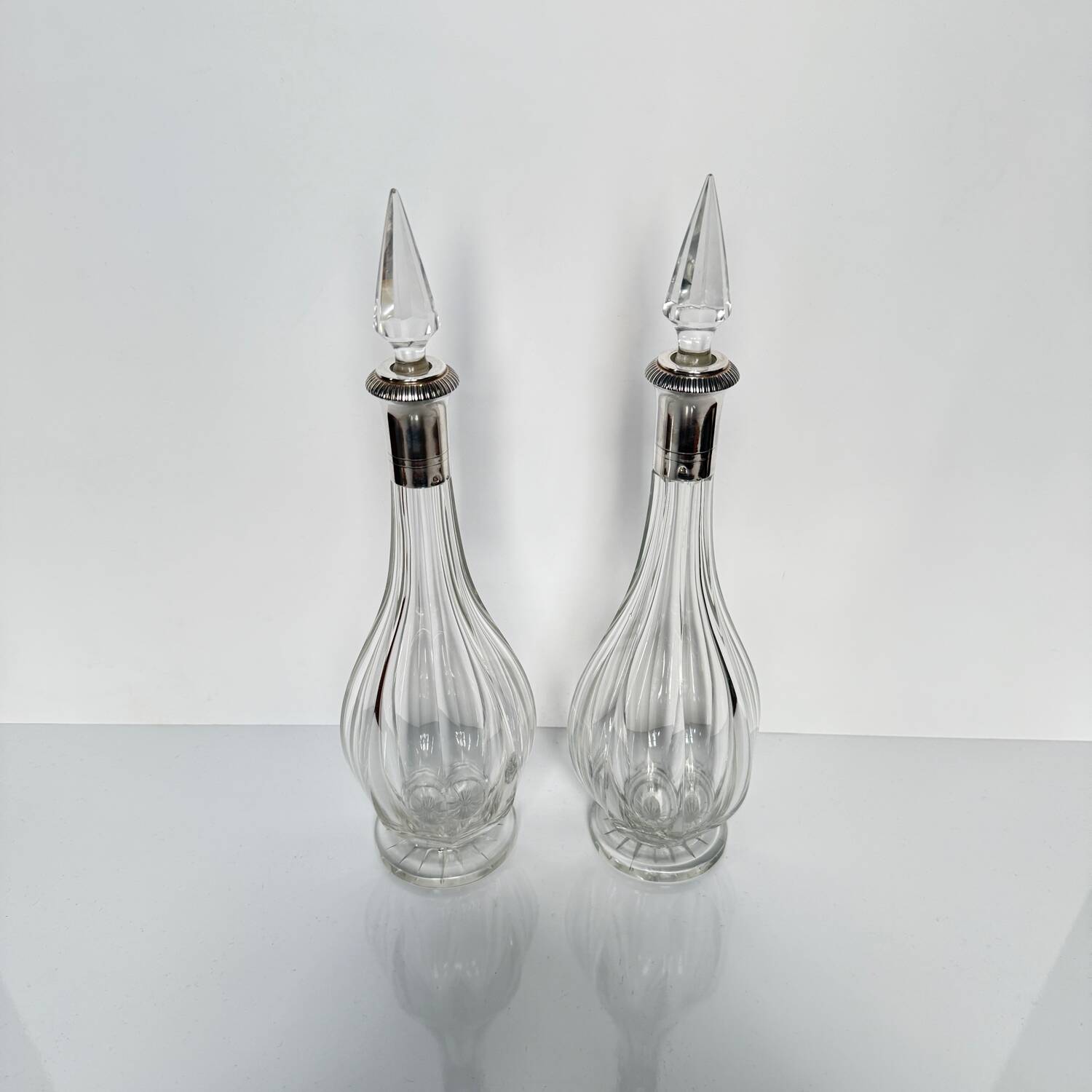 Pair of crystal decanters with solid silver mounts