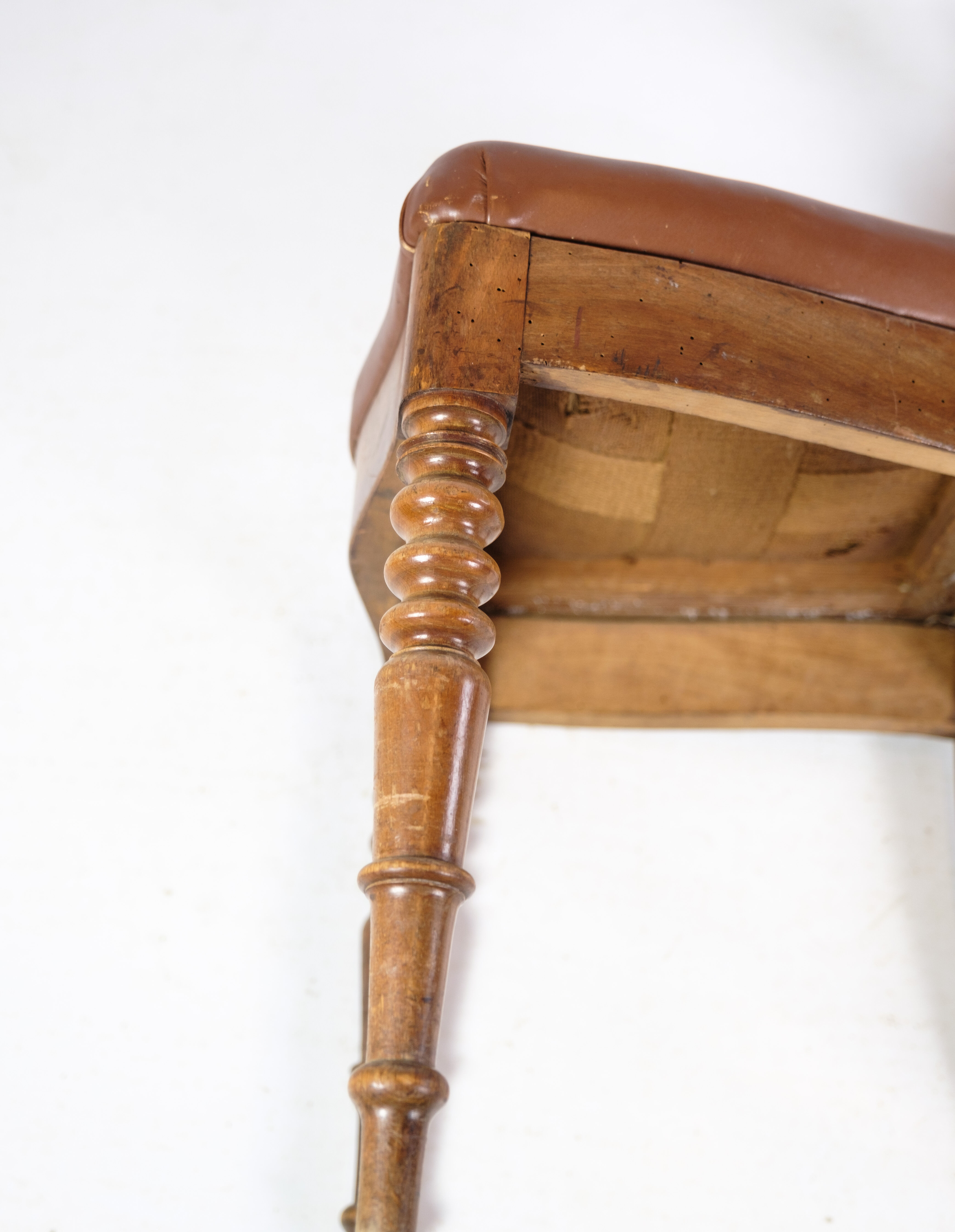 Set of eight late empire chairs in high quality brown leather in mahogany