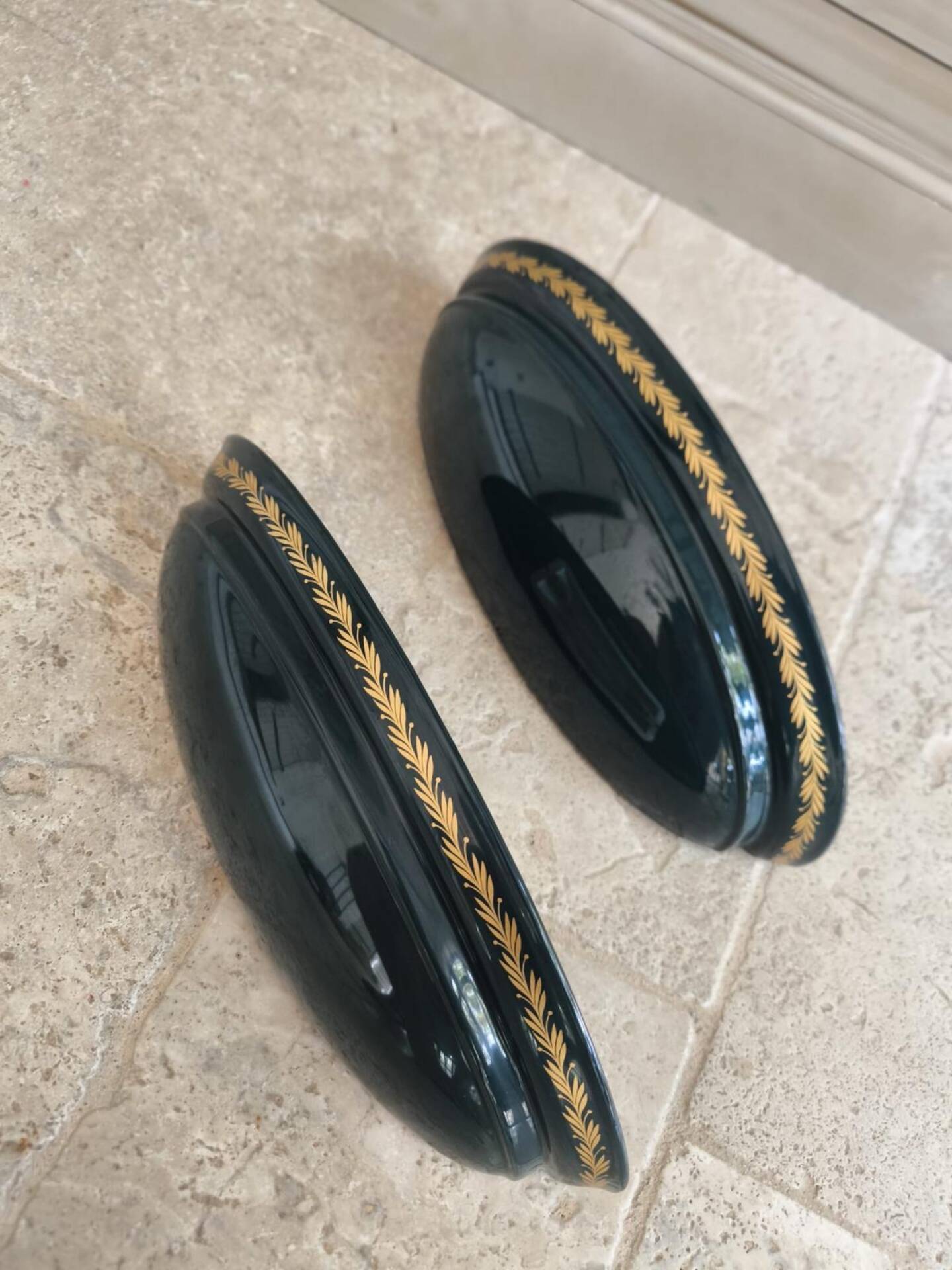 Set of two vintage wall sconces in pine green and gold.
