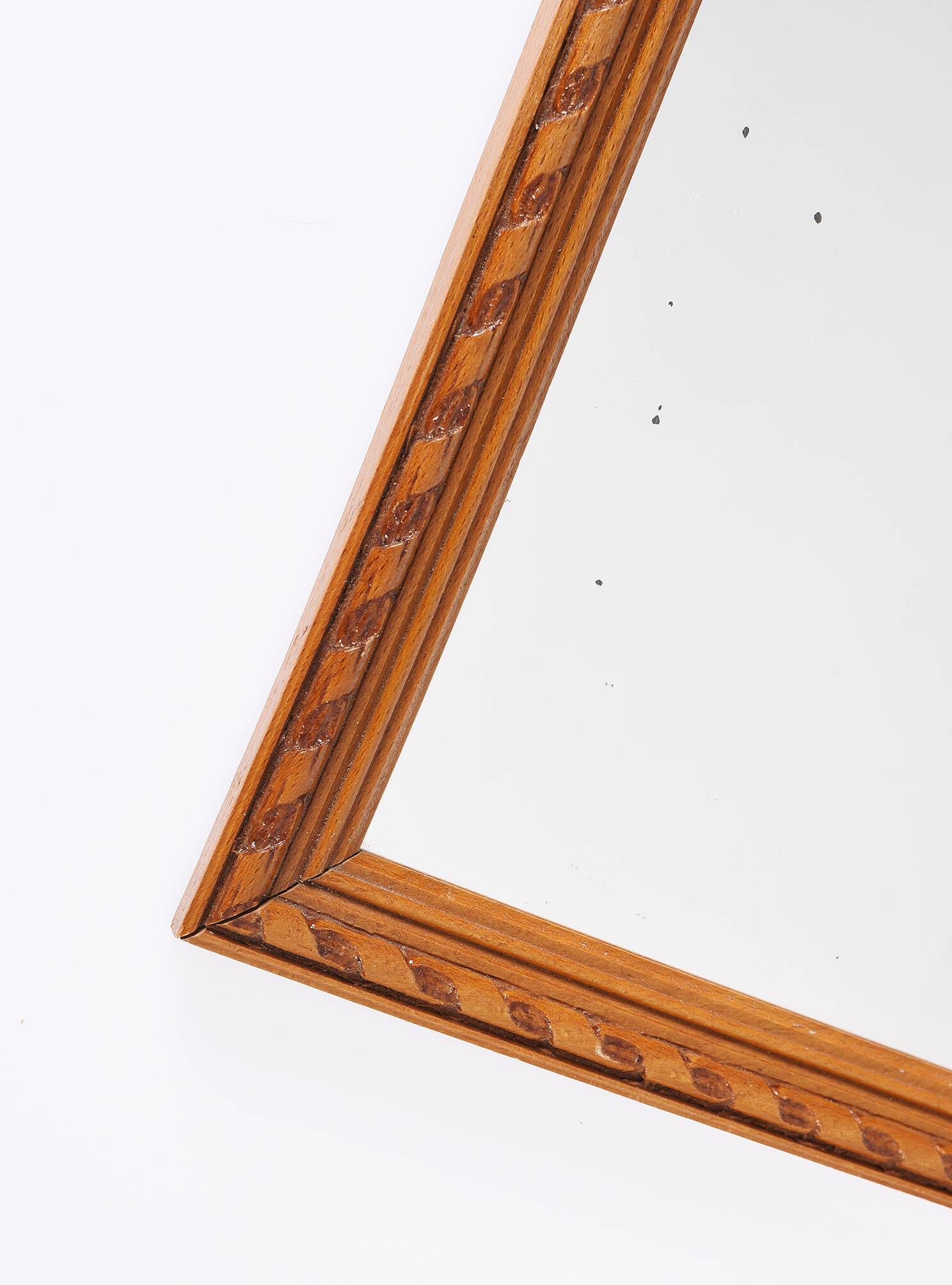 Small old wooden mirror with carved frame