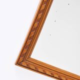 Small old wooden mirror with carved frame