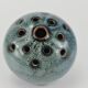 Vase with blue flowers.