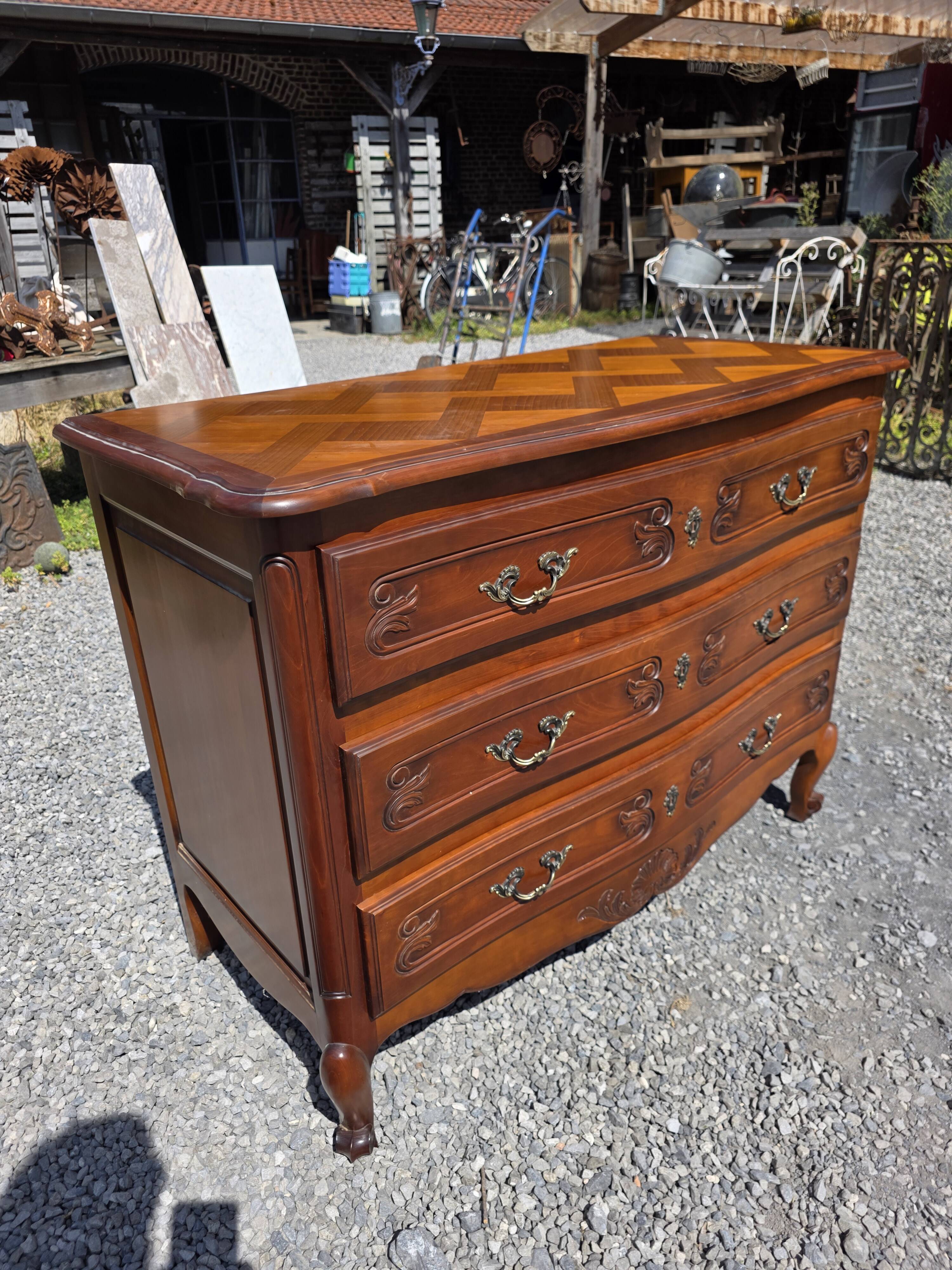 Curved commode in Louis XV style made of cherry wood.
