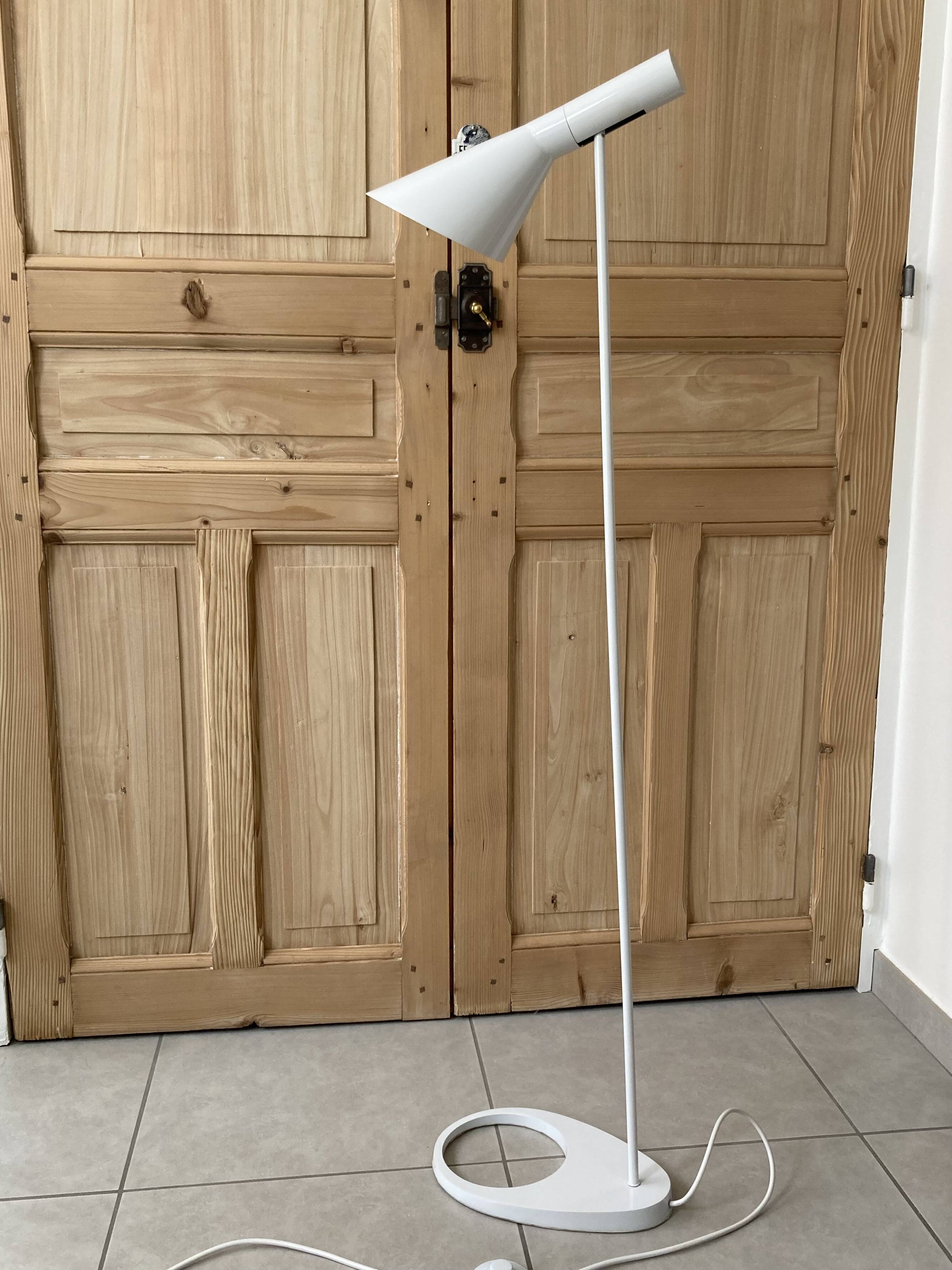 white lacquered metal reading lamp