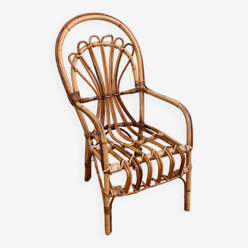 Small old rattan armchair for children