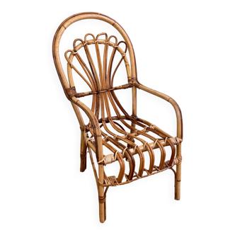 Small old rattan armchair for children