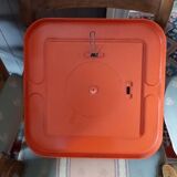 Small orange vintage mirror.