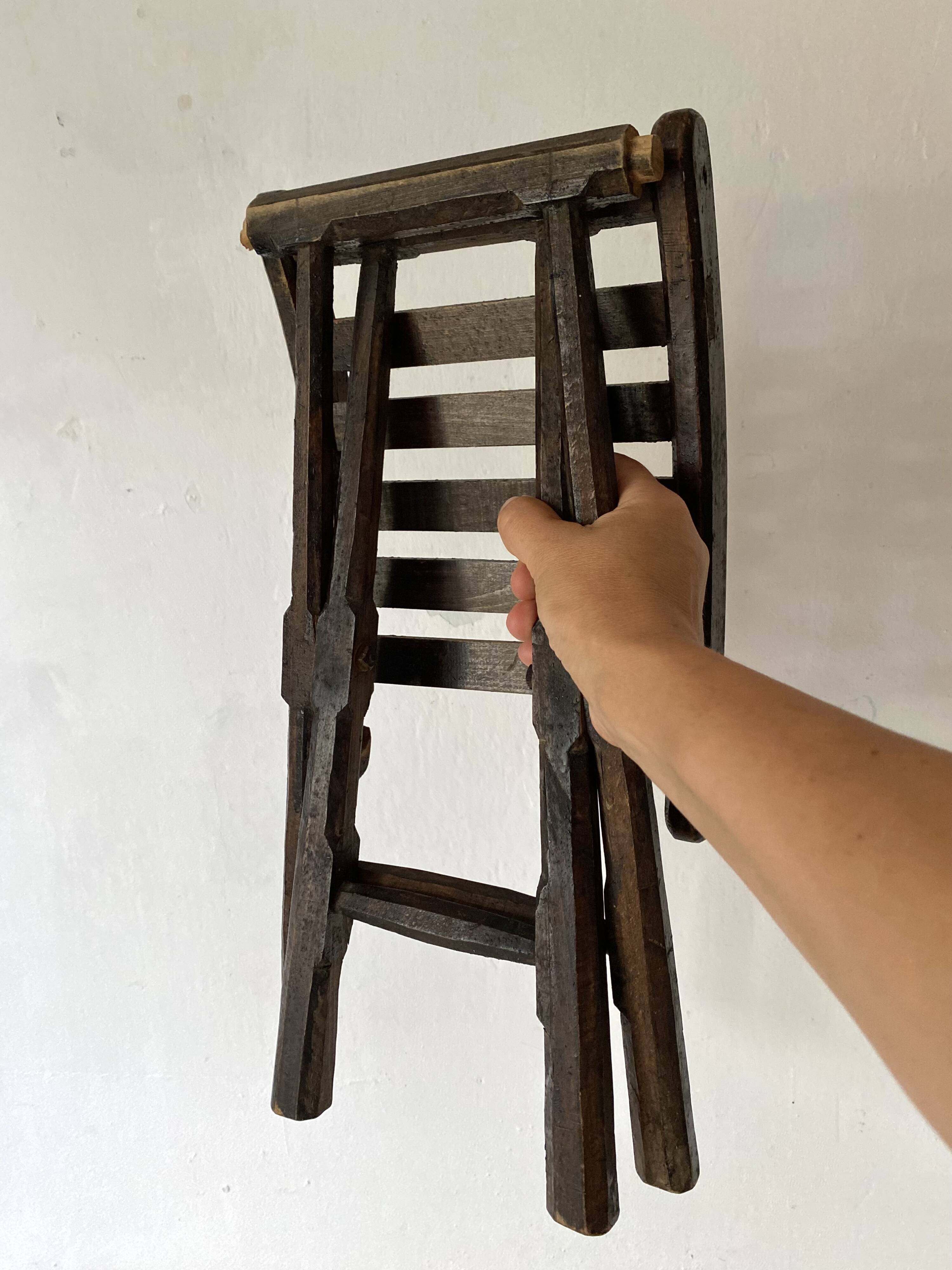 Folding slatted wooden stool