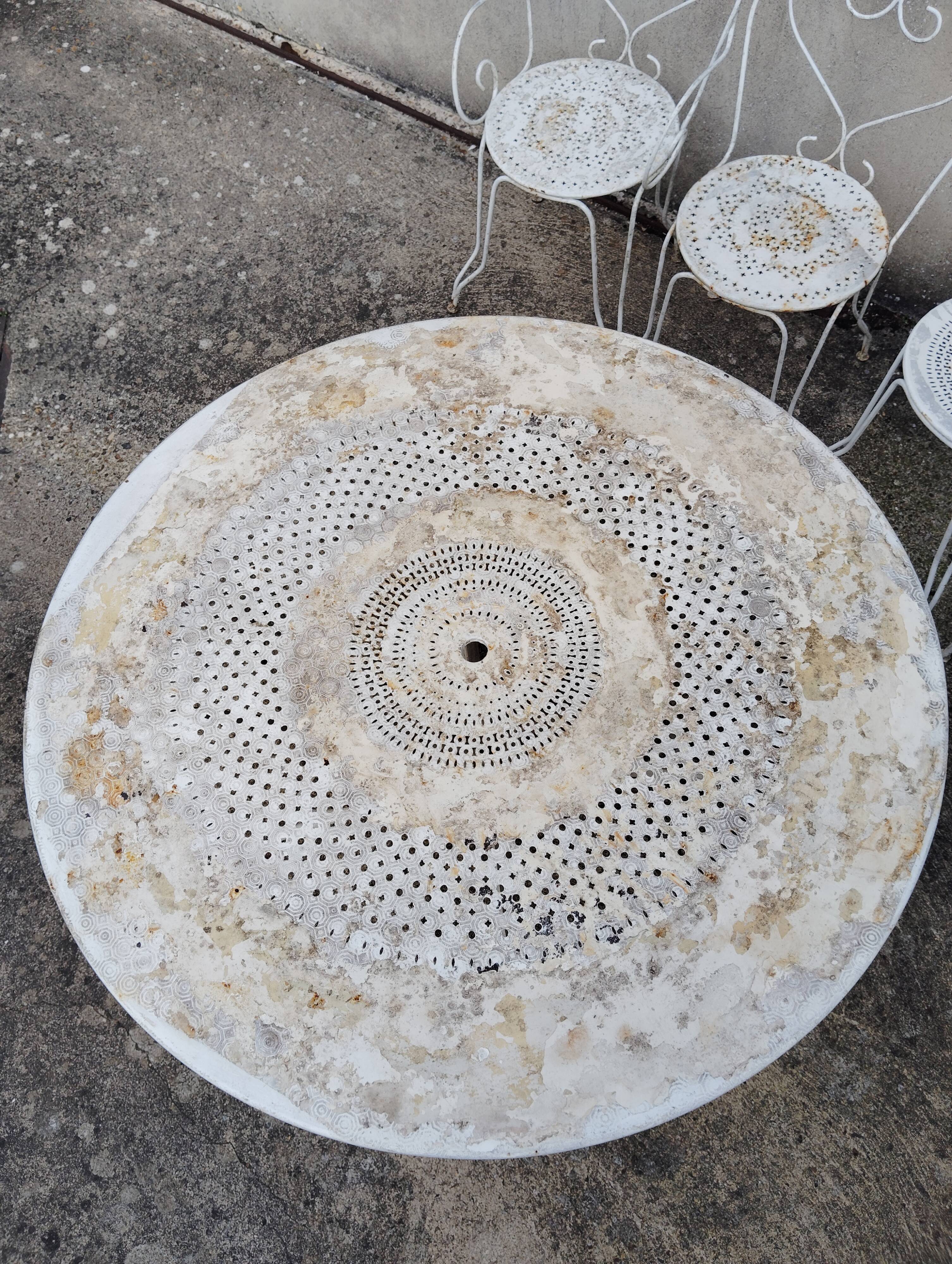 Wrought iron garden furniture from the early 20th century.