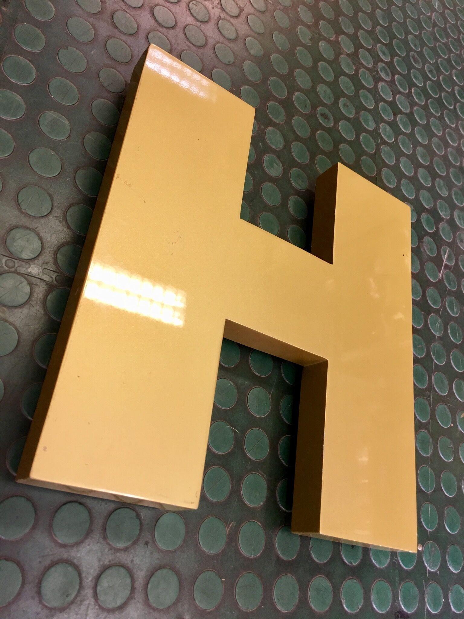Golden sign letter h