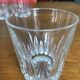 Mismatched decanter and whiskey glasses
