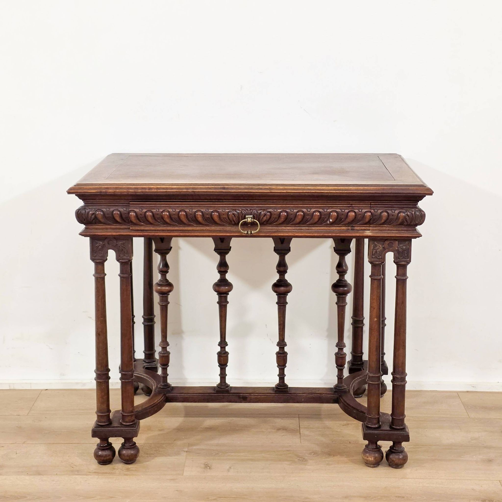 Carved walnut writer's desk in Renaissance style, late 19th century.