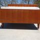 Vintage bed in teak with integrated bedside table.