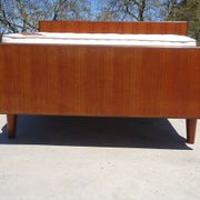Vintage bed in teak with integrated bedside table.