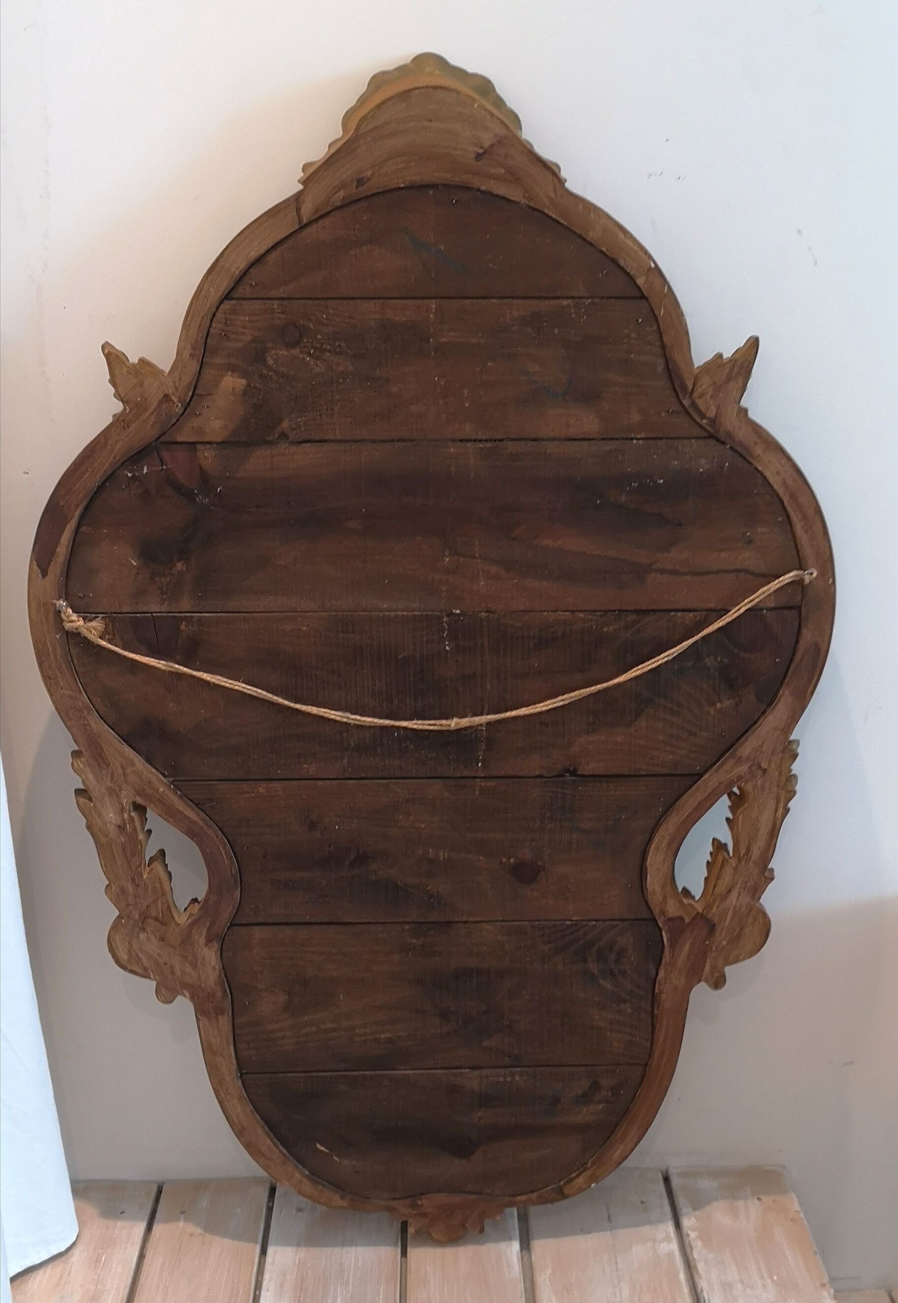 Elongated oval baroque gilded mirror