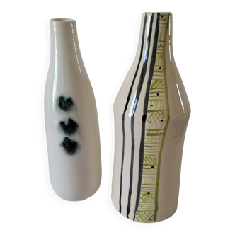 A pair of glazed ceramic vases, pictorial decoration, signed MU.