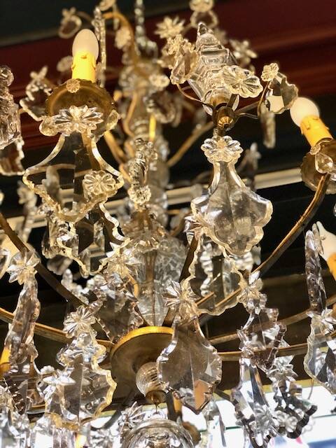 Large chandelier with tassels and old daggers