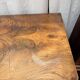 Antique English commode in flame walnut.