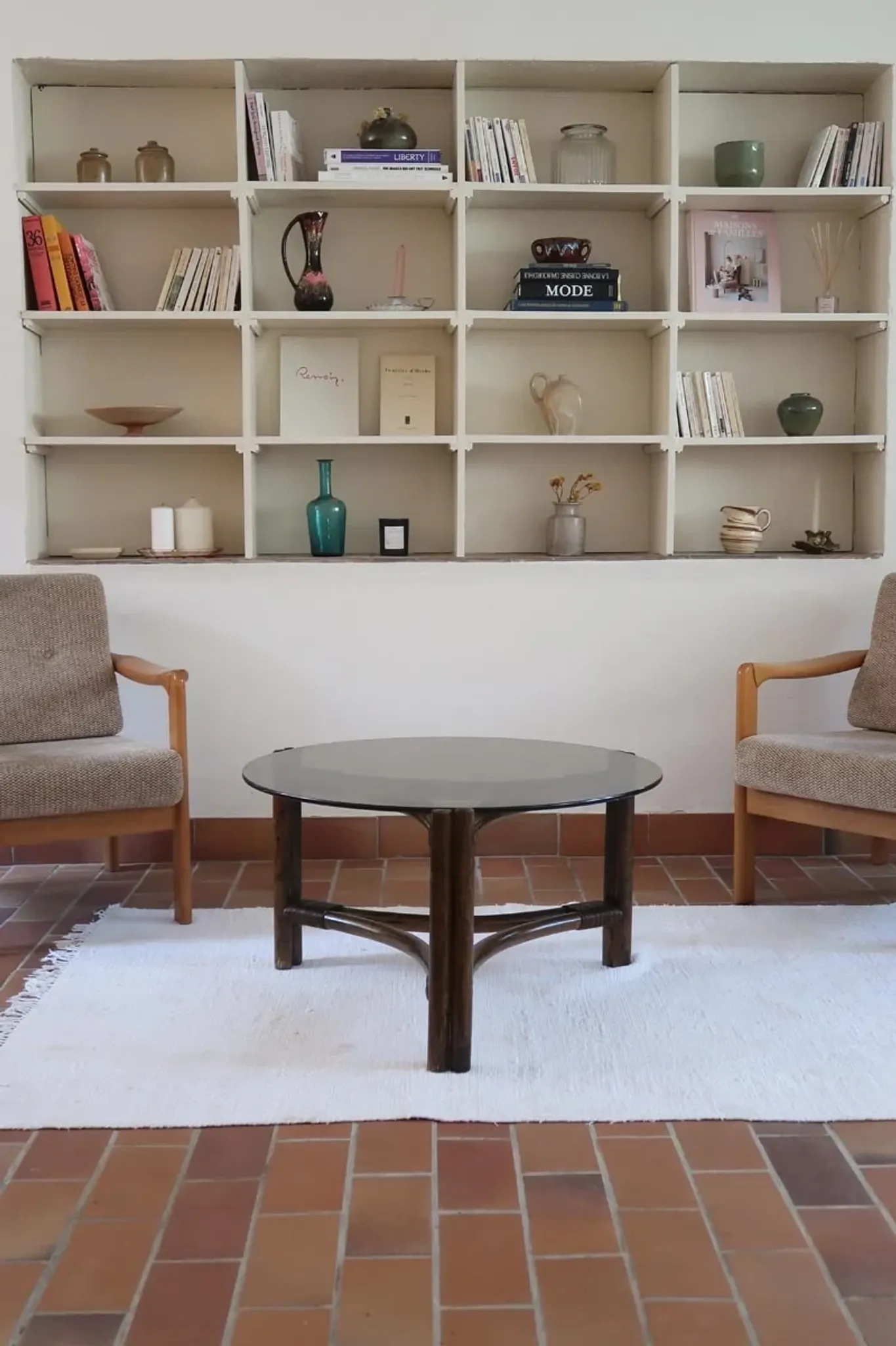 Round coffee table in rattan and smoked glass — 1970s