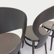 Set of 4 vintage Mouette chairs by Baumann in black wood from the 1960s.
