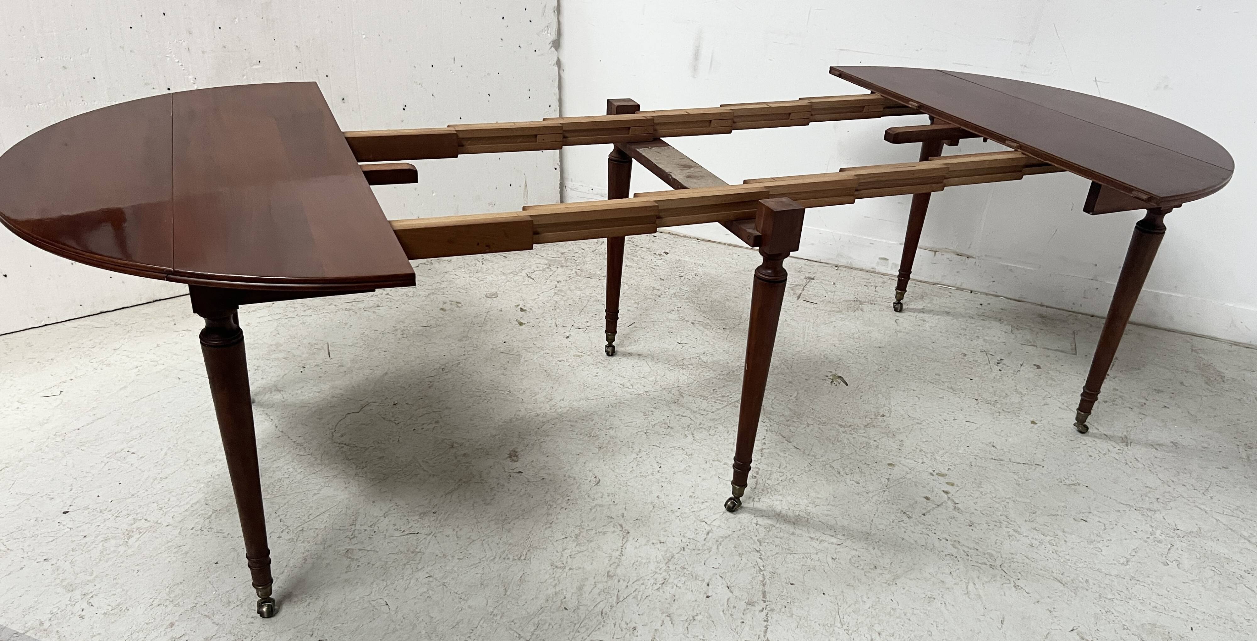 A six-foot Louis XVI style mahogany table from the 19th century.