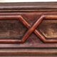 Italian sculpted mirror, patinated brown and gold wood, architectural frame from the 1960s.