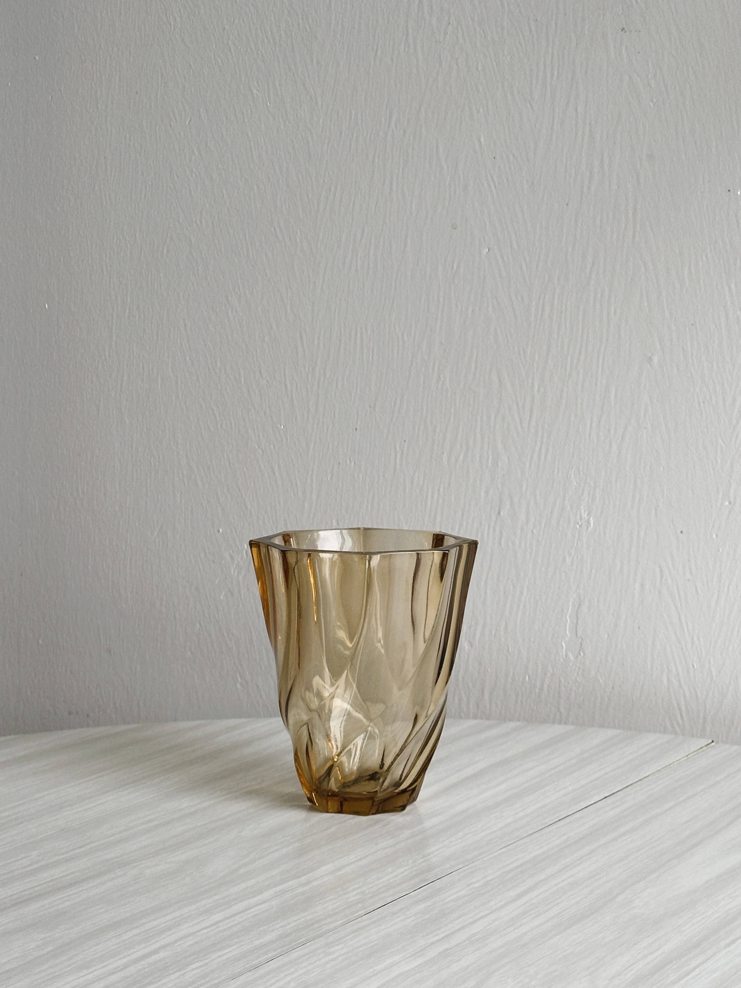 Small translucent pink twisted glass vase