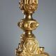 Antique gilded bronze candelabrum, 19th-century decorations.
