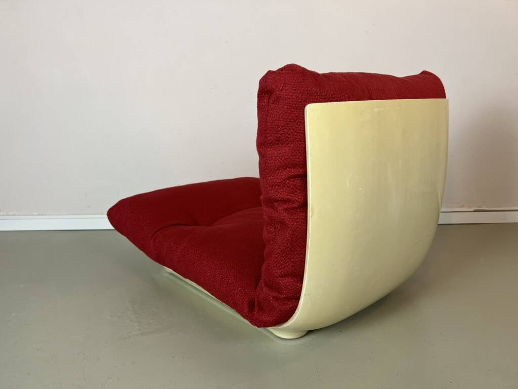 Vintage red shell lounge chairs from the 70s mid-century retro.