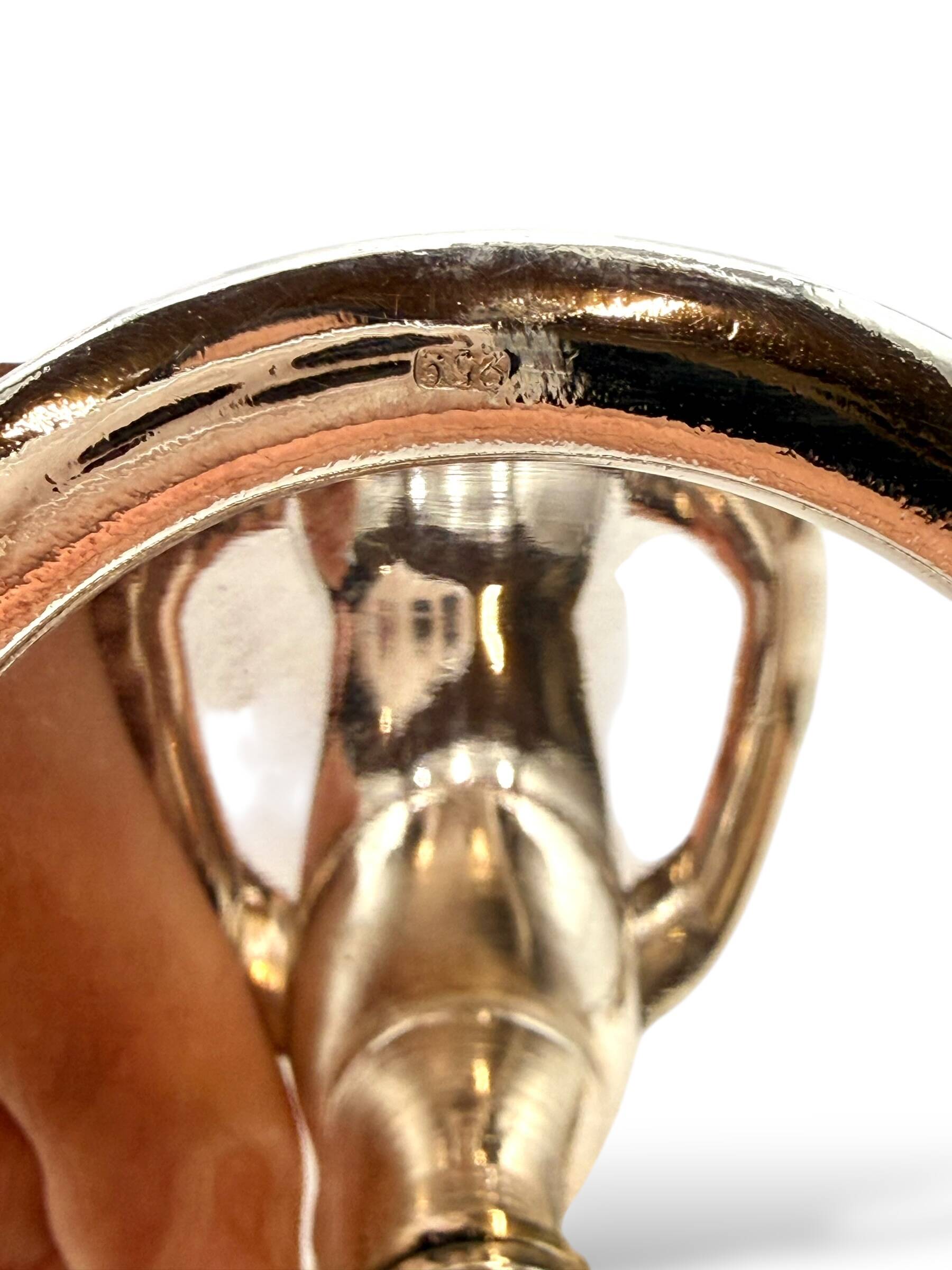 Silver-plated champagne bucket with ring handles.