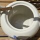 Vintage ceramic tea set for 6 bowls and a teapot.