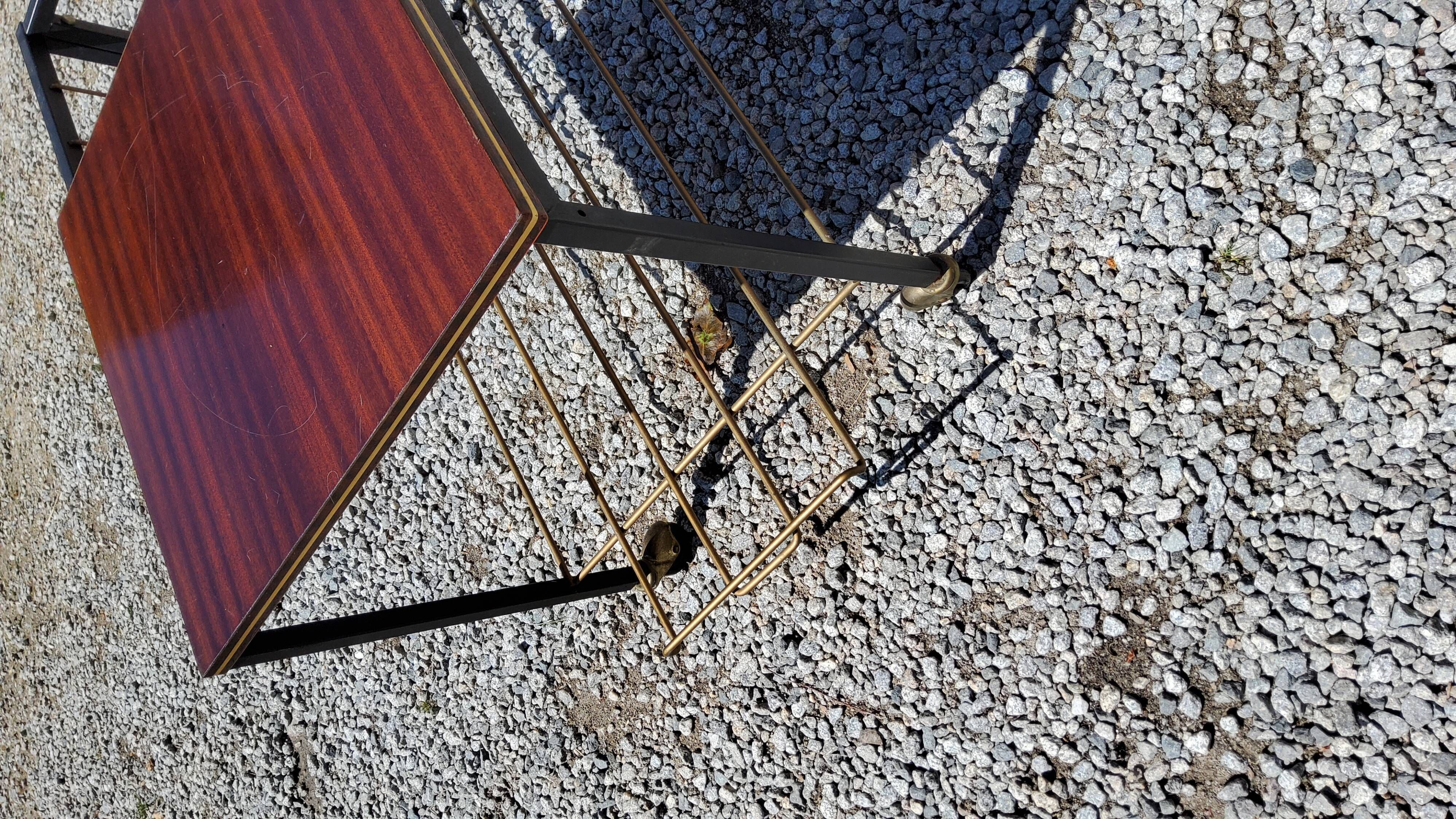Coffee table from the 60s in black and gold metal tubes mahogany formica top