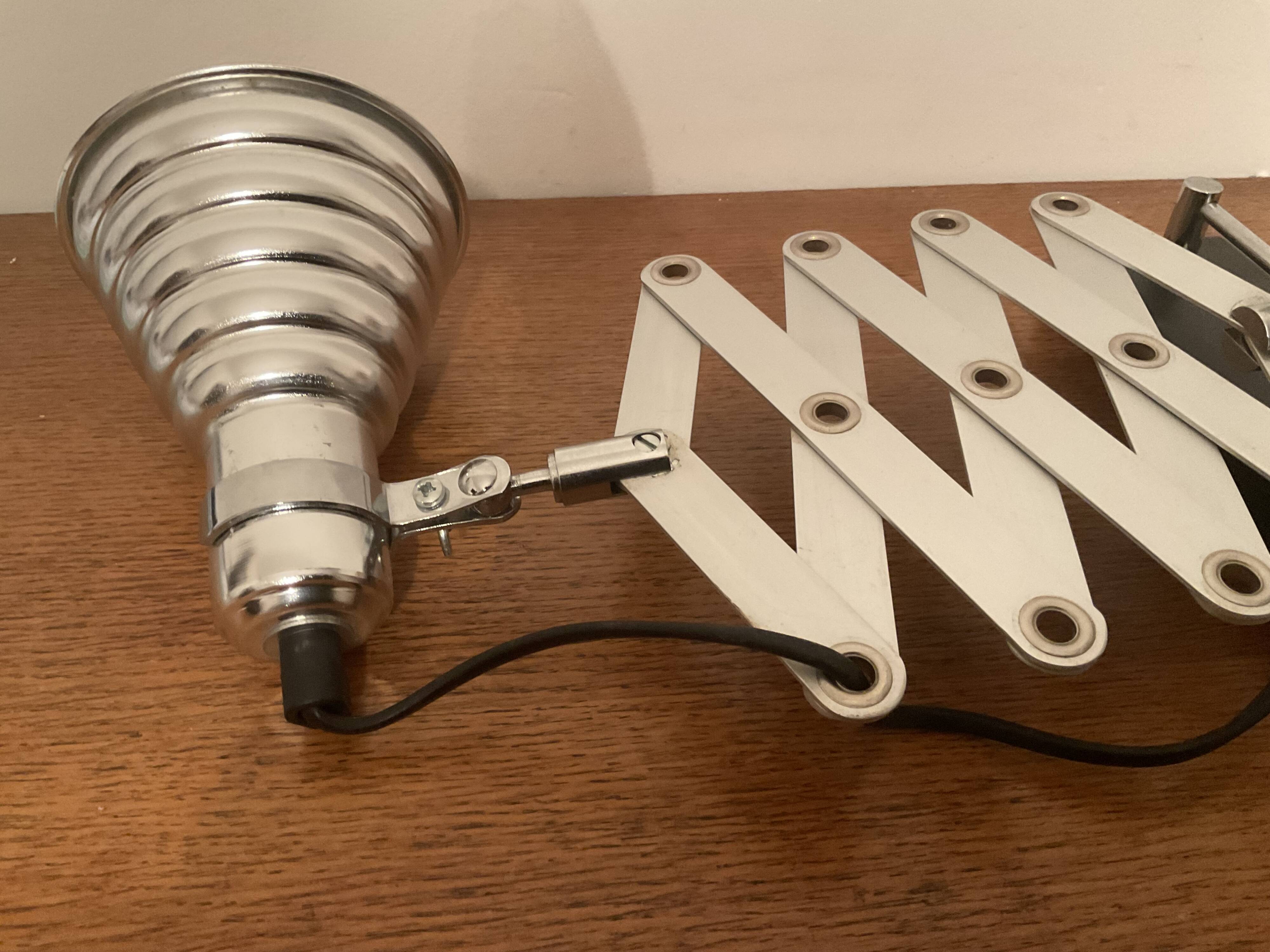 Industrial accordion wall light