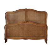 Lit double antique en fond de canne de style Louis XV, France