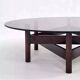Wooden coffee table with round smoked glass top