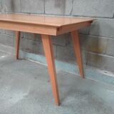 Dining table with compass feet