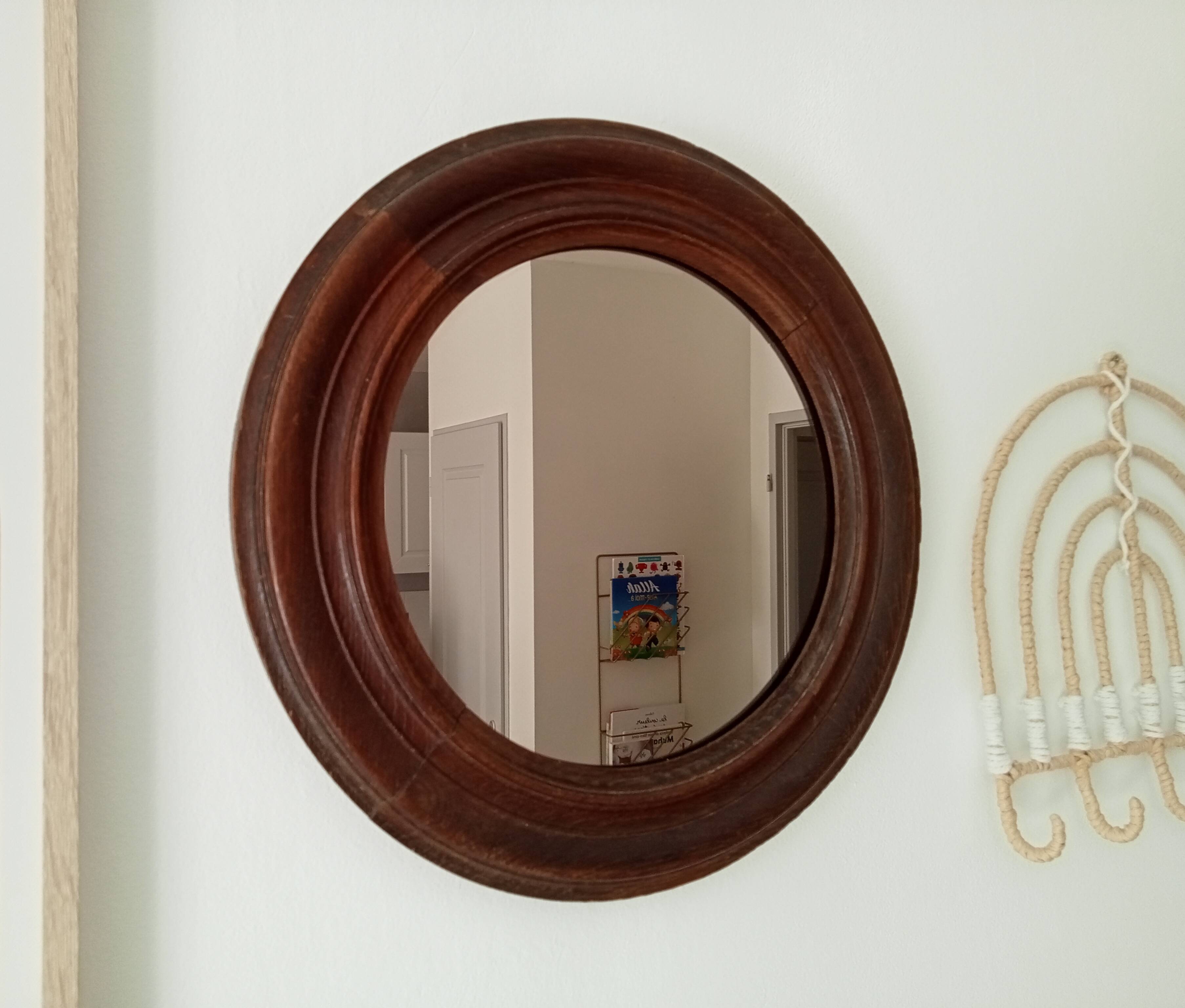 Antique round wooden mirror