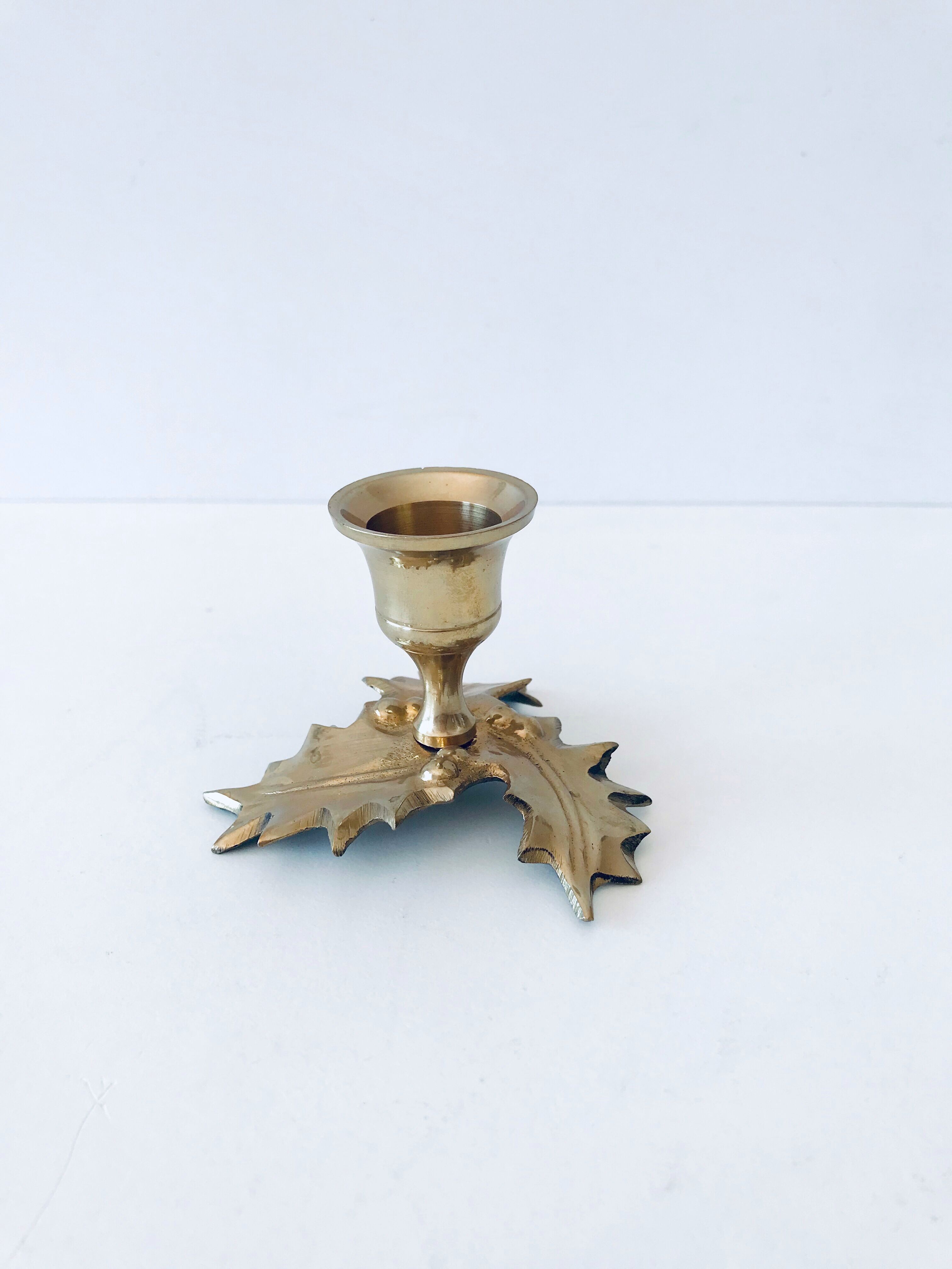 Candlestick in brass holly design
