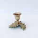 Candlestick in brass holly design