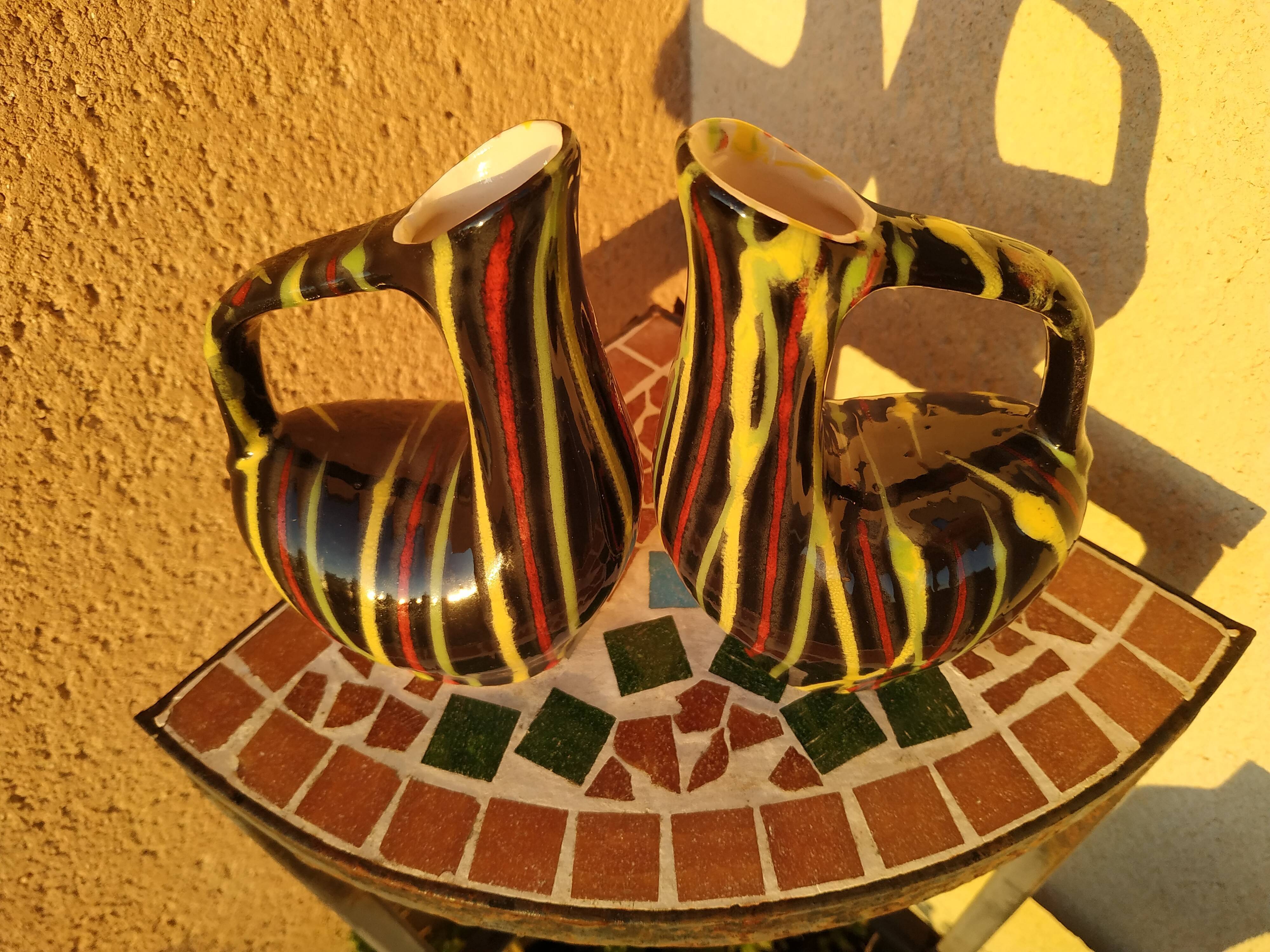 Pair of small zoomorphic pourers striped 50s