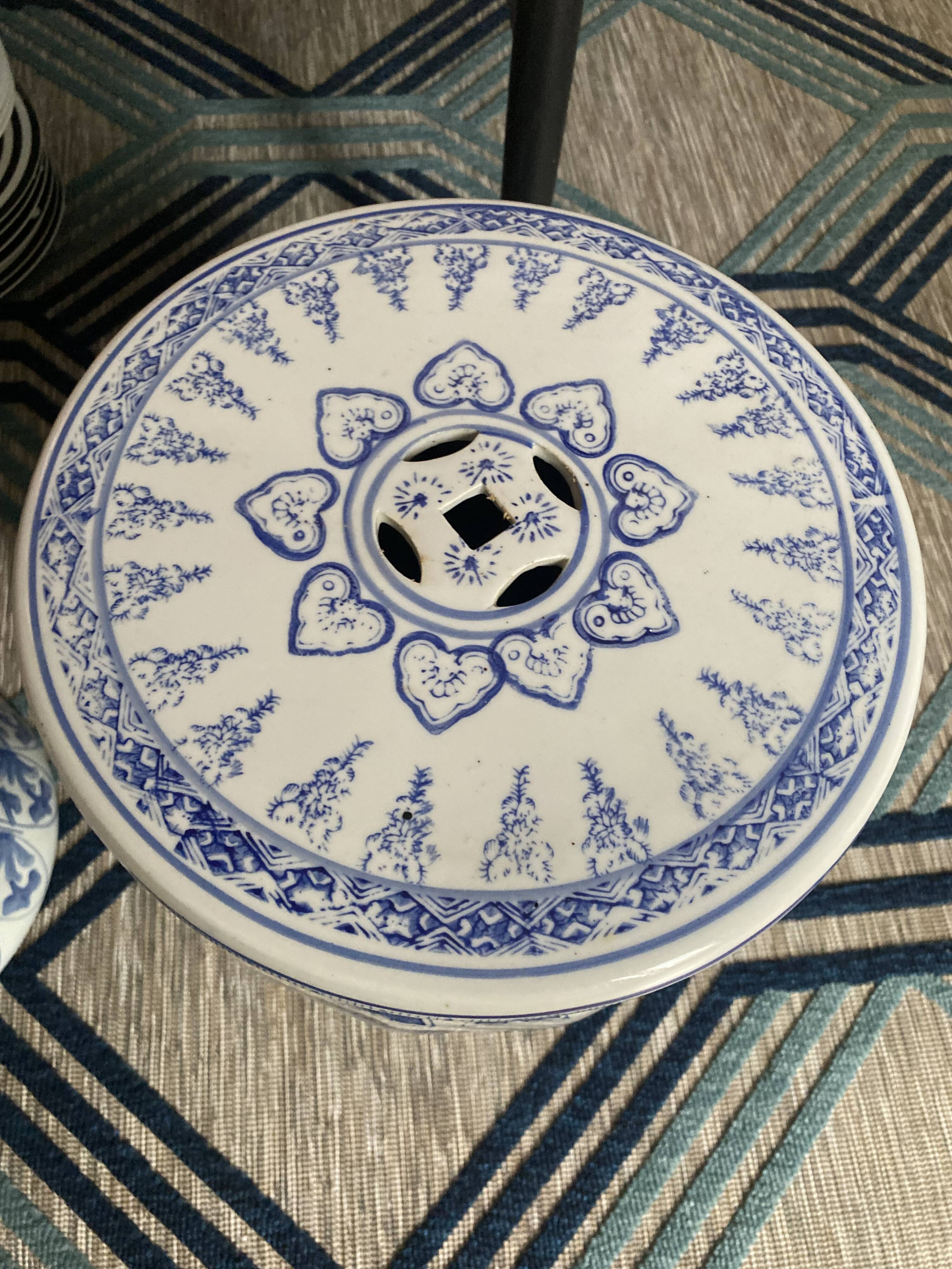Set of two white and blue porcelain side tables.
