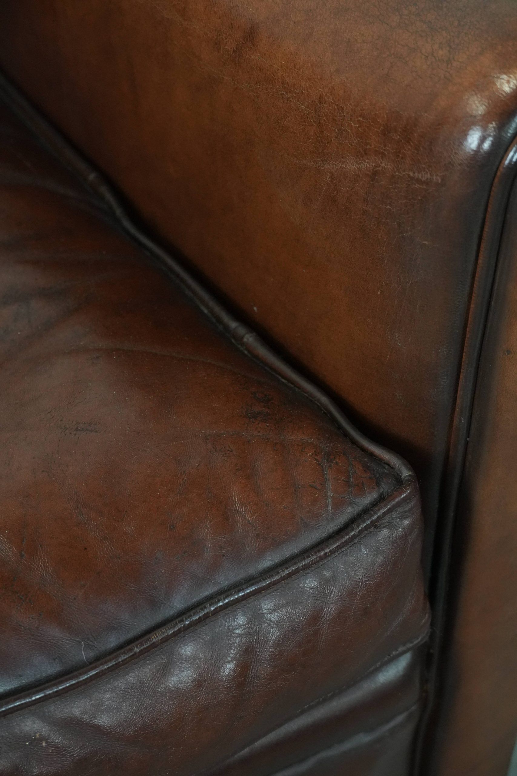 Armchair made of sheepskin leather in art deco design with warm colours