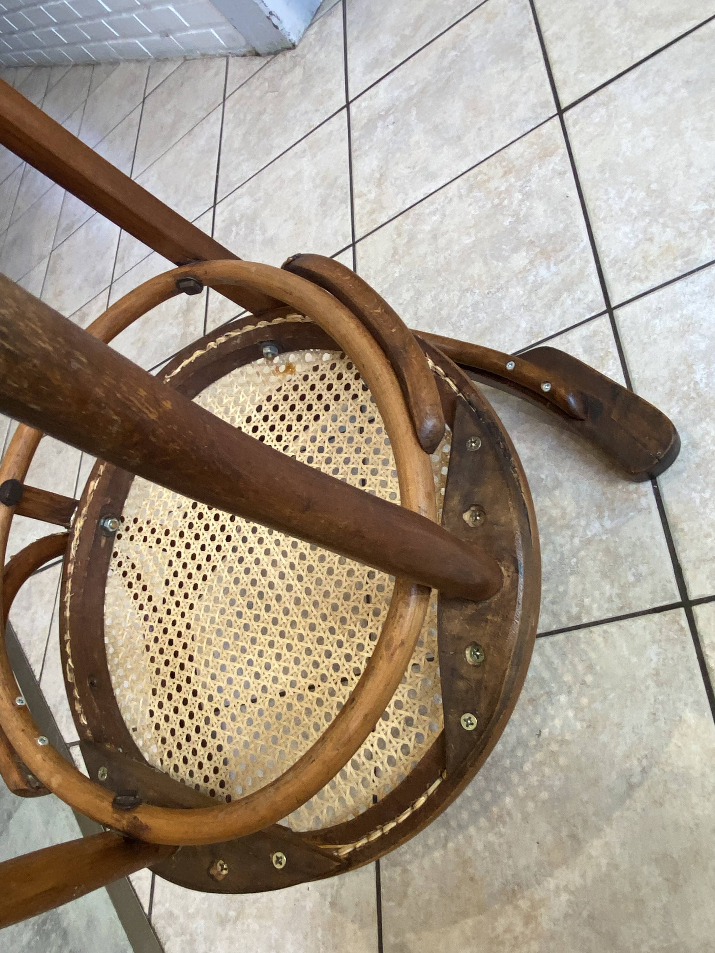 Bistro chair with a curved wooden frame and caned seat from the 1930s.