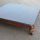 Coffee table with industrial wheels