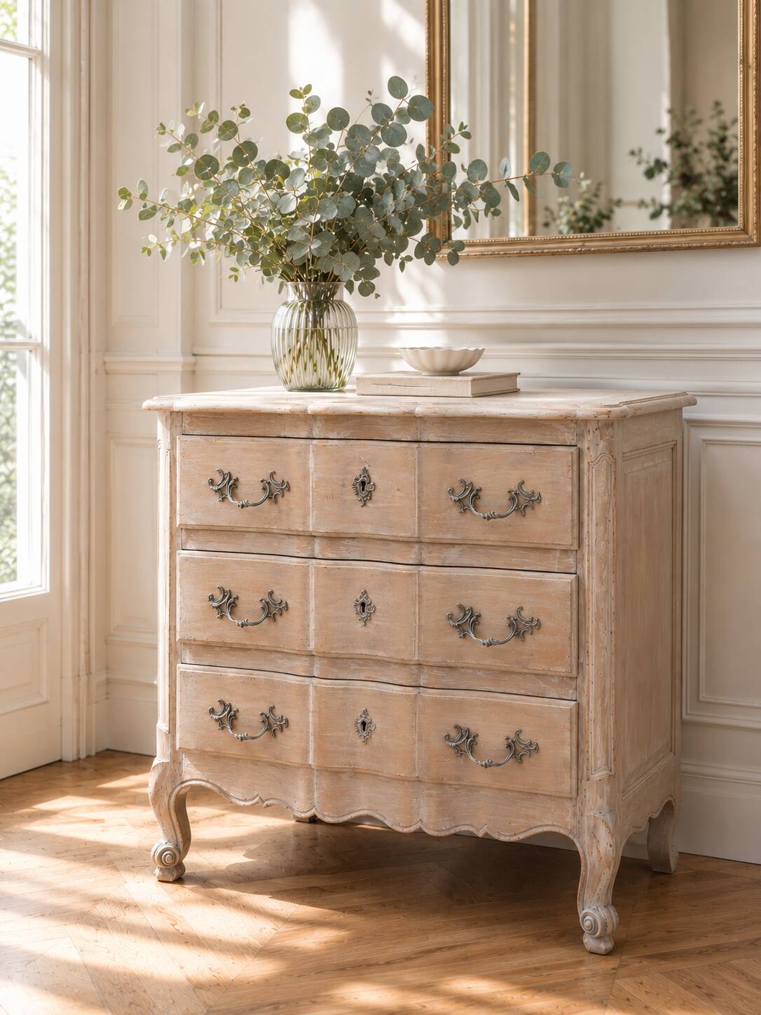 Beautifully crafted Louis XVI style commode in bleached wood.