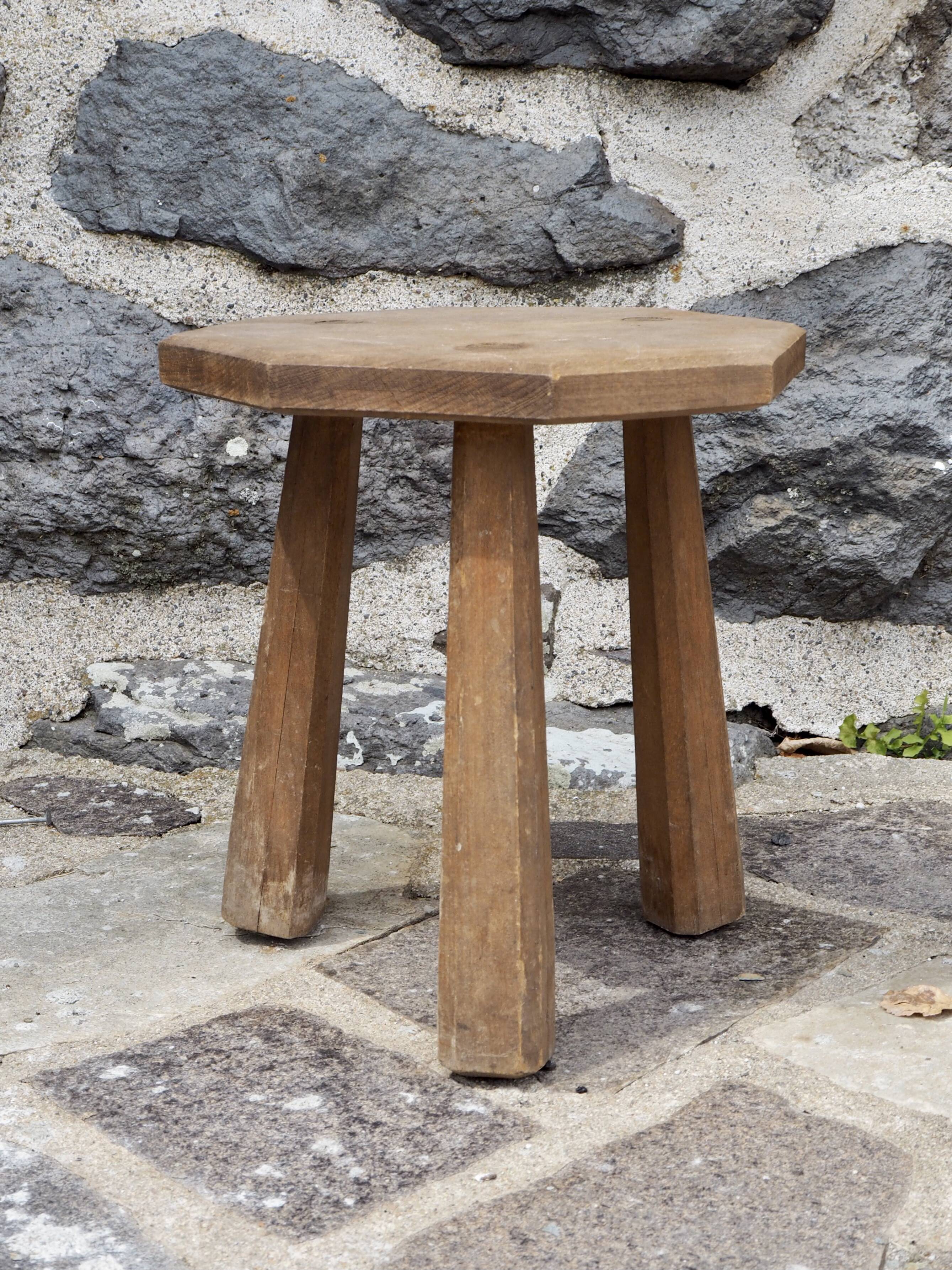 Raw wood tripod stool with octagonal seat