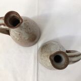 Duo of pitchers signed enamelled sandstone 1970