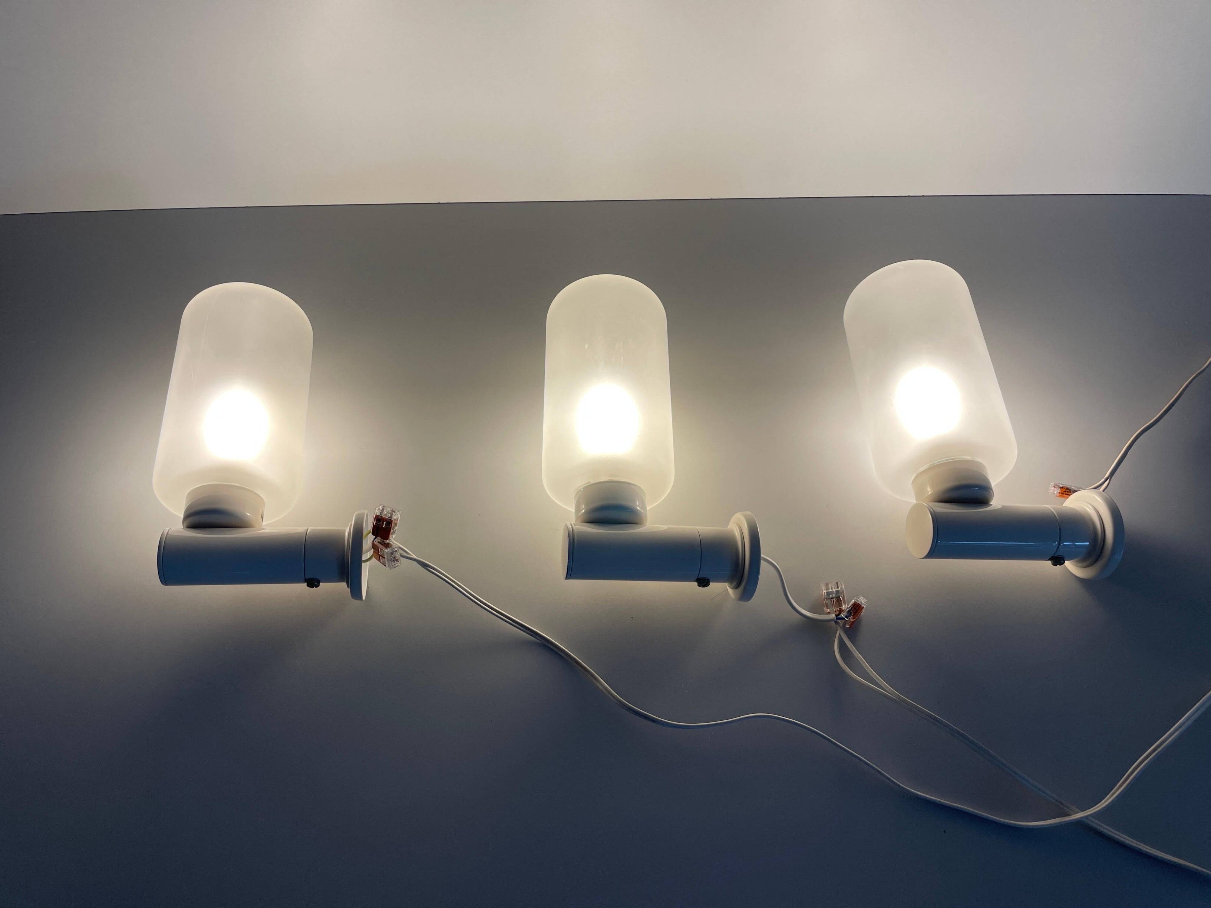 Set of 3 semi-transparent glass and white metal wall lights, 1960, Germany