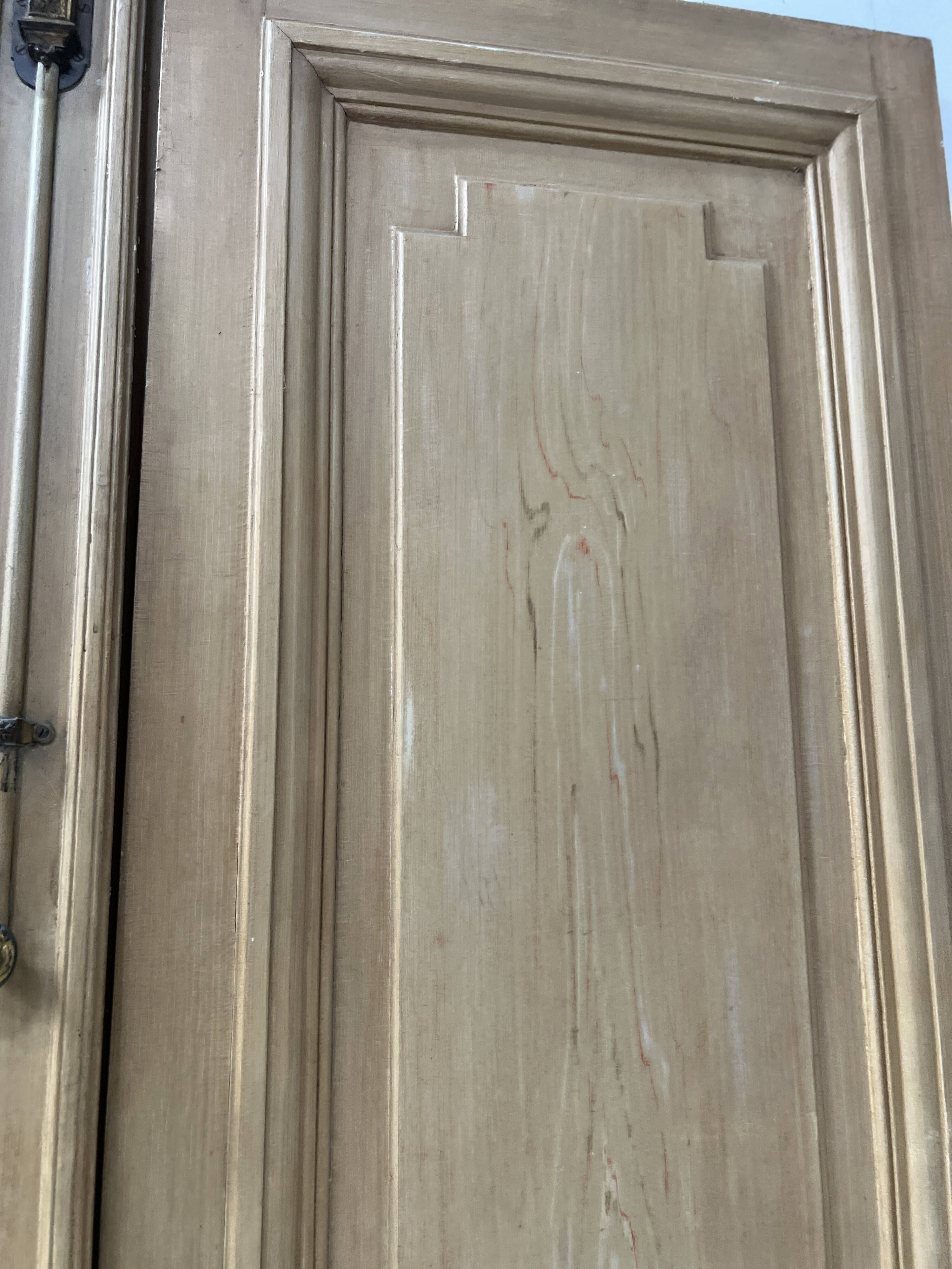 Pair of Haussmann-style double passage doors in patinated oak from the 19th century.