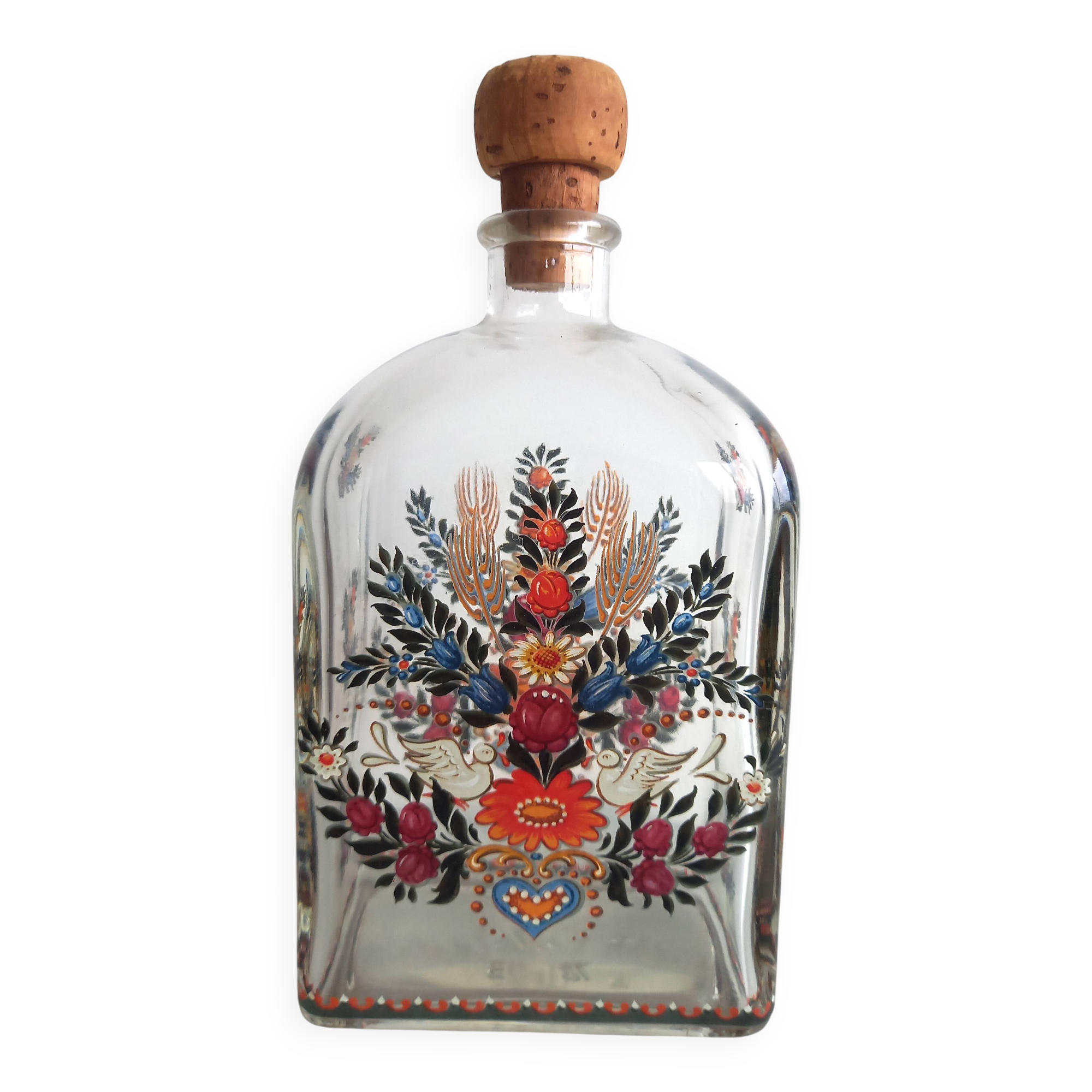 Bottle with folkloric decoration of flowers and birds inspired by Eastern countries